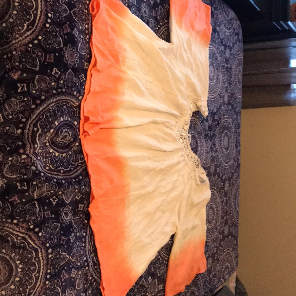 Swimsuit cover up or off the shoulder boho blouse.